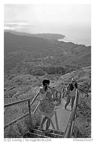 Tourists take a photo on the last steps of the Diamond Head crater summit trail. Oahu island, Hawaii, USA
