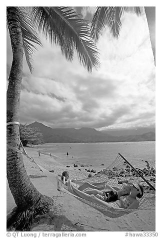 Family on Hammock, Puu Poa Beach. Kauai island, Hawaii, USA (black and white)