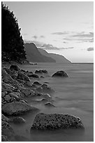 Boulders, surf, and Na Pali Coast, sunset. Kauai island, Hawaii, USA (black and white)