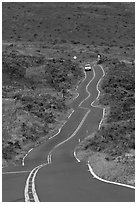 Car on winding Pilani Highway. Maui, Hawaii, USA (black and white)