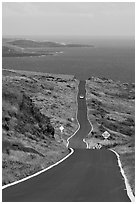 One-lane road overlooking ocean. Maui, Hawaii, USA ( black and white)