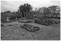 Graves made of lava rocks, Kaupo cemetery. Maui, Hawaii, USA (black and white)