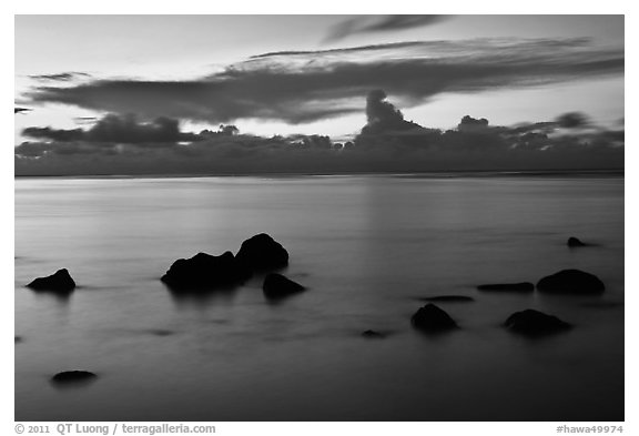 Rocks and cloud band, sunset. Kauai island, Hawaii, USA (black and white)