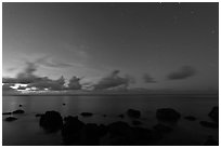 Rocks, ocean, and stars. Kauai island, Hawaii, USA ( black and white)