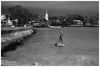 Paddlesurfer and Kailua-Kona. Hawaii, USA ( black and white)