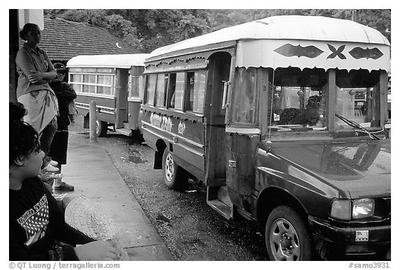 Colorful aiga busses, Pago Pago. Pago Pago, Tutuila, American Samoa (black and white)