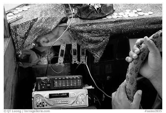 Hands of Aiga bus driver and sound system. Pago Pago, Tutuila, American Samoa (black and white)