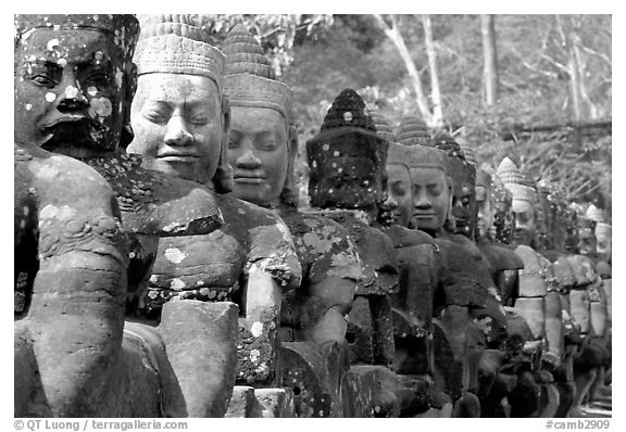 Statues near the gates of the temple complex. Angkor, Cambodia (black and white)