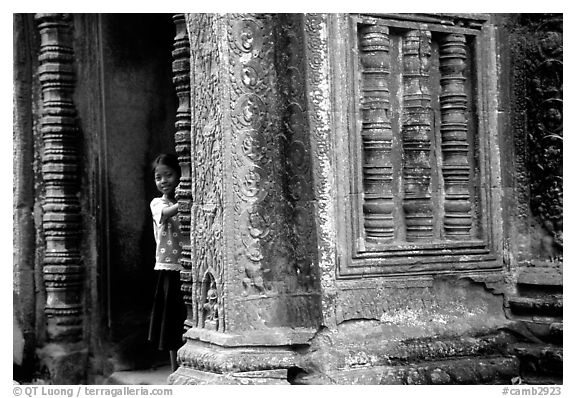 Girl hides in Ta Prom. Angkor, Cambodia (black and white)