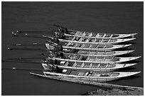 Fast boats on the Mekong river. With their 40 HPW Toyota engines, they cruise at 50 mph on the river. Mekong river, Laos (black and white)