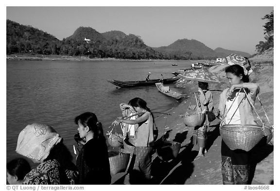 Women on the banks of the Mekong river. Luang Prabang, Laos