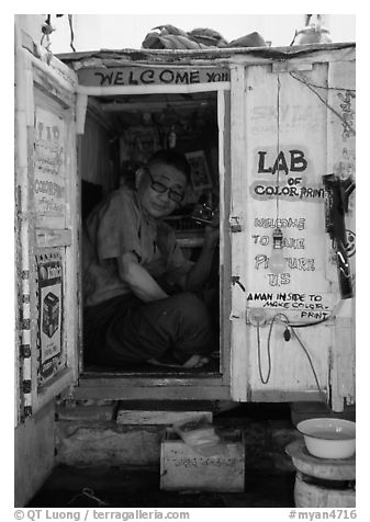 Man in one-room photo lab. Bagan, Myanmar (black and white)