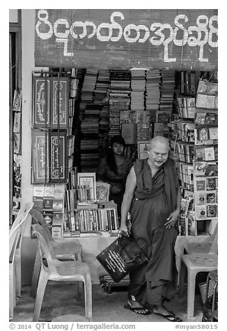 Monk leaves bookstore, Shwedagon Pagoda. Yangon, Myanmar (black and white)