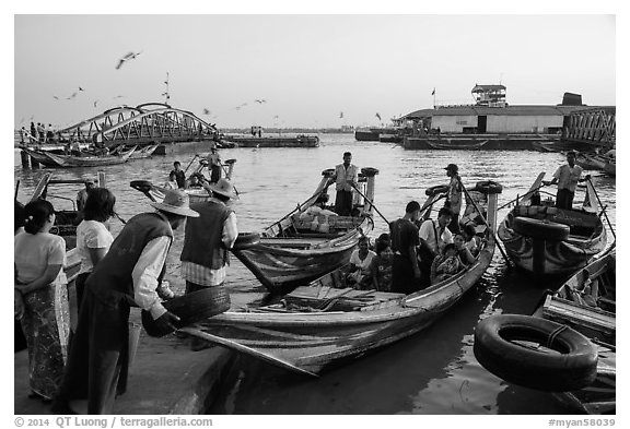 Passengers on oared water taxi crossing Yangon River. Yangon, Myanmar (black and white)