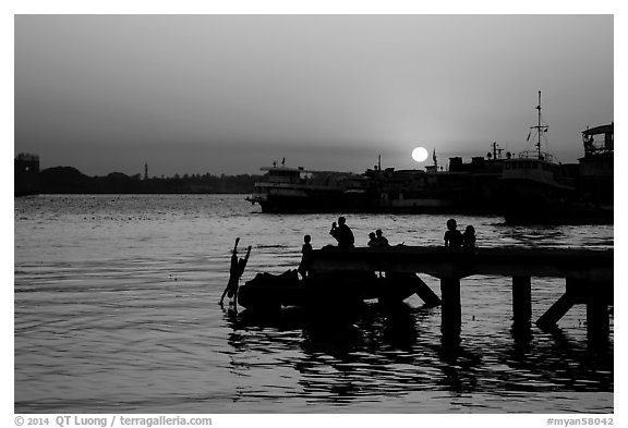 Diving into the Yangon River at sunset. Yangon, Myanmar (black and white)