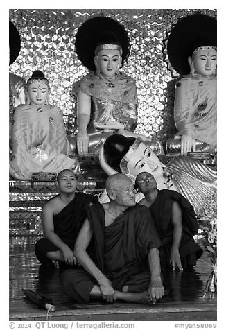 Monks and buddha statues, Shwedagon Pagoda. Yangon, Myanmar (black and white)