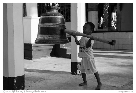 Child ringing bell, Shwedagon Pagoda. Yangon, Myanmar (black and white)
