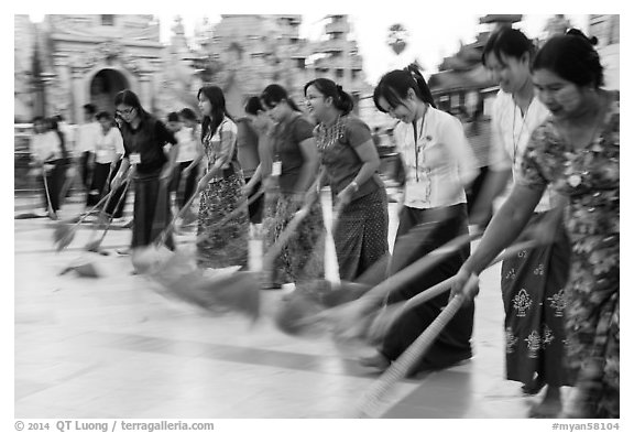 Row of women sweeping, Shwedagon Pagoda. Yangon, Myanmar (black and white)