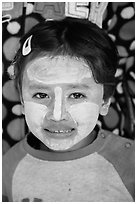 Infant with face covered in thanaka paste. Bagan, Myanmar ( black and white)