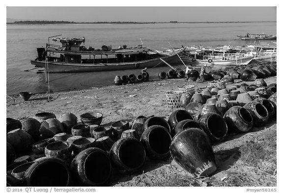 Unloading jars on the Ayeyarwaddy River. Bagan, Myanmar (black and white)