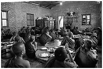 Novices in prayer before lunch, Nyaung U. Bagan, Myanmar ( black and white)