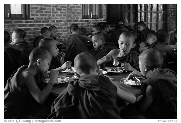 Novices eat lunch, last meal of the day. Bagan, Myanmar (black and white)