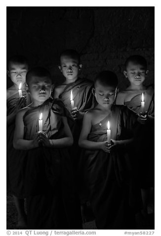 Group of buddhist novices holding candles. Bagan, Myanmar (black and white)