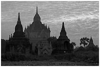 Temples profiled against brilliant sunrise sky. Bagan, Myanmar ( black and white)