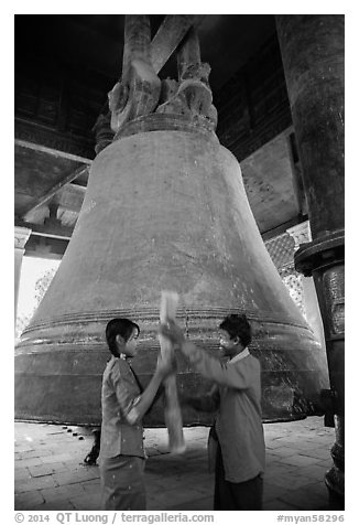 Boy and girl ringing huge bell, Mingun. Myanmar (black and white)