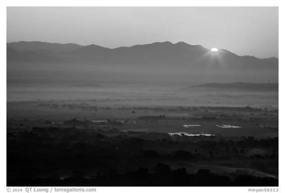 Sun rising over Shan Yoma mountains. Mandalay, Myanmar (black and white)