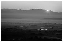 Sun rising over Shan Yoma mountains. Mandalay, Myanmar ( black and white)