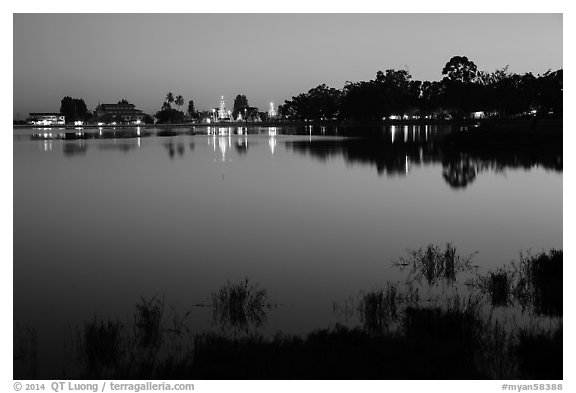 Illuminated pagoda reflected in Pone Tanoke Lake. Pindaya, Myanmar (black and white)