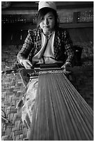 Young padaung woman weaving. Inle Lake, Myanmar ( black and white)