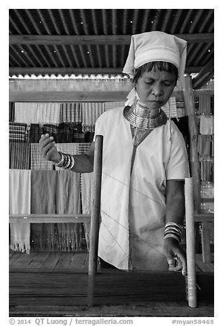 Padaung (long neck) woman threading yarn. Inle Lake, Myanmar (black and white)