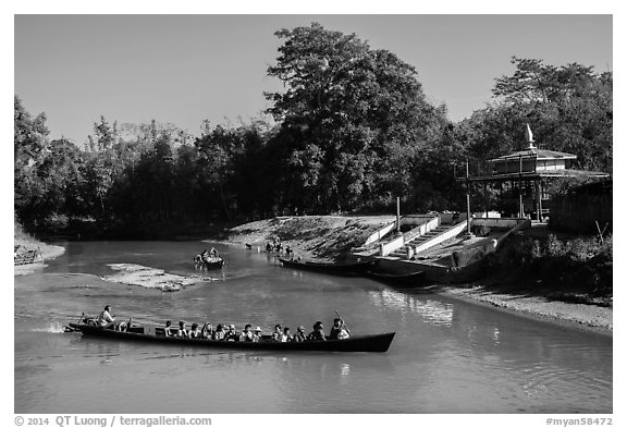 Villagers navigating canal in narrow boat, Indein. Inle Lake, Myanmar (black and white)