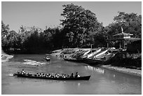 Villagers navigating canal in narrow boat, Indein. Inle Lake, Myanmar ( black and white)