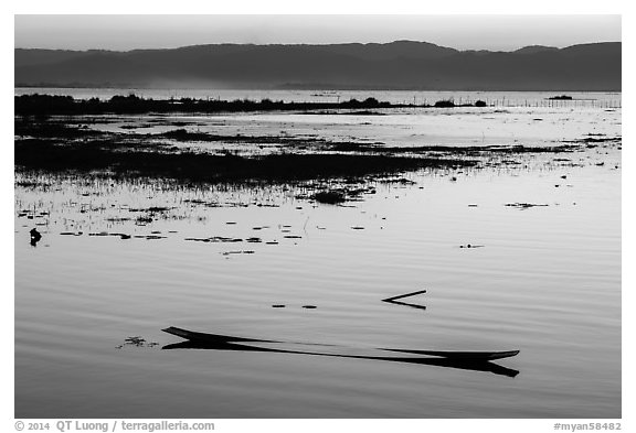 Sunken canoe at sunset. Inle Lake, Myanmar (black and white)