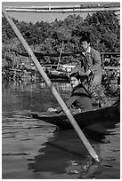 Couple leaving market on their boat. Inle Lake, Myanmar ( black and white)