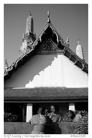 Monks outside Wat Arun. Bangkok, Thailand (black and white)