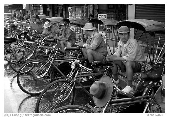 Tricycle drivers. Chiang Rai, Thailand (black and white)