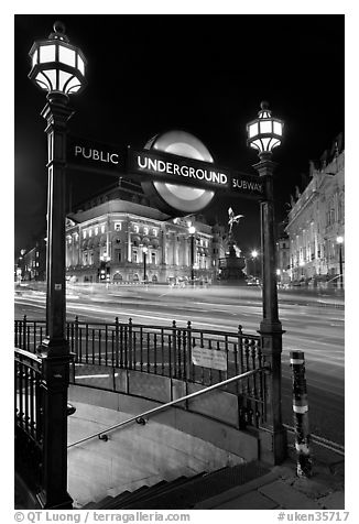Underground  entrance and lights from traffic at night, Piccadilly Circus. London, England, United Kingdom (black and white)