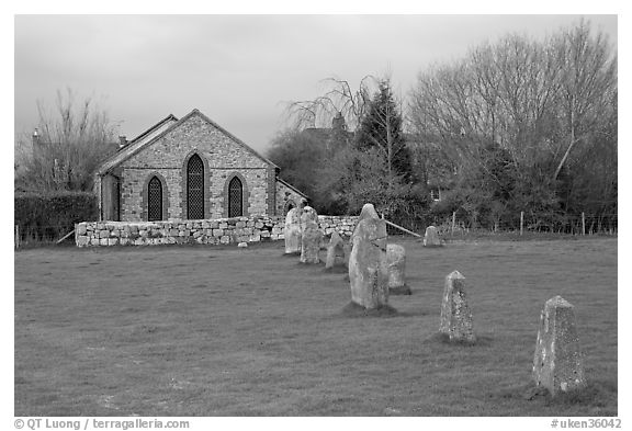 Small standing stones and chapel, Avebury, Wiltshire. England, United Kingdom (black and white)