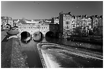 Weir on the Avon River and Pulteney Bridge. Bath, Somerset, England, United Kingdom ( black and white)
