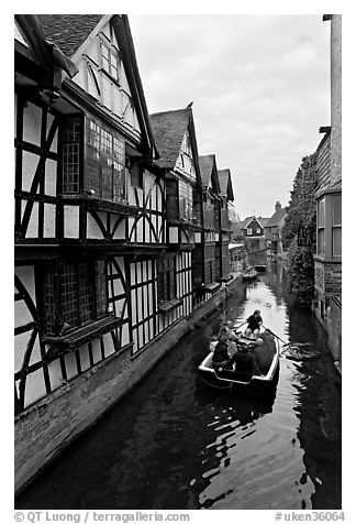 Half-timbered house, canal, and rowboat. Canterbury,  Kent, England, United Kingdom