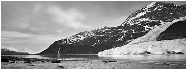 Landscape with tidewater glacier and waterfall. Prince William Sound, Alaska, USA (Panoramic black and white)