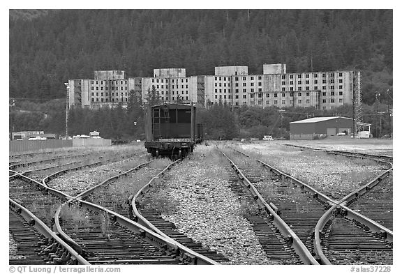Rail tracks and Buckner building. Whittier, Alaska, USA (black and white)