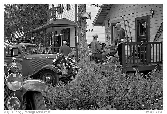Vintage cars and houses on main street. McCarthy, Alaska, USA (black and white)