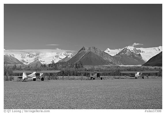 Bush planes on McCarthy airfield  and Wrangell range. McCarthy, Alaska, USA (black and white)