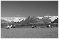 Bush planes on McCarthy airfield  and Wrangell range. McCarthy, Alaska, USA (black and white)