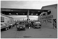 Cars and Rv at gas station The Hub of Alaska, Glennalen. Alaska, USA ( black and white)